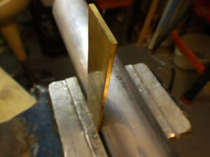 a piece of brass before the bending process